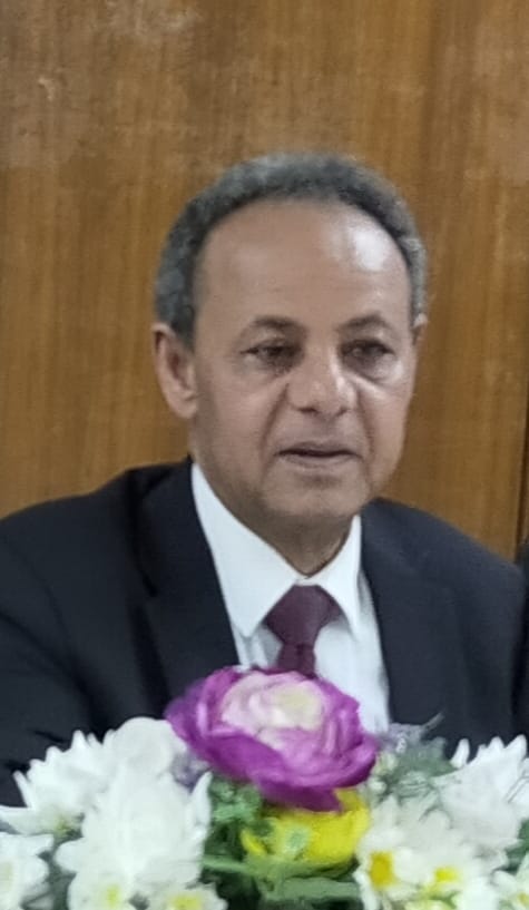 Behind Abdul Azim Syed